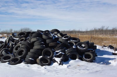 Pile of tires covered in Snow